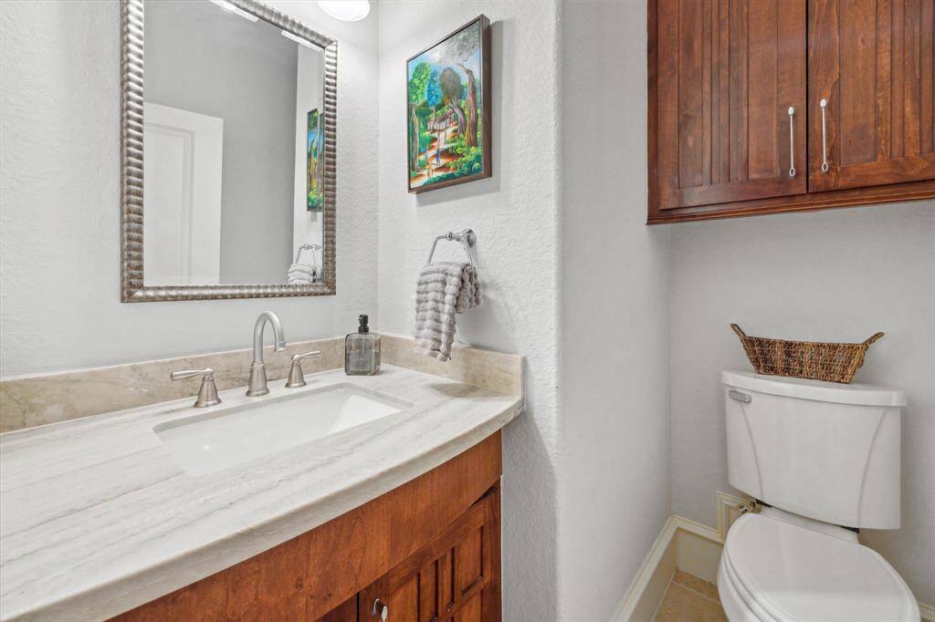 [Half Bath] Located off the family room.
