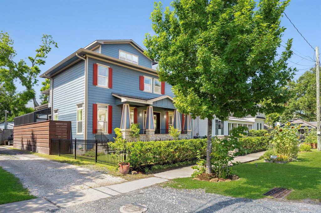 In the heart of Houston Heights, enjoy rare guest parking out front and alley access to an oversized two-car garage with a workshop and ample storage.