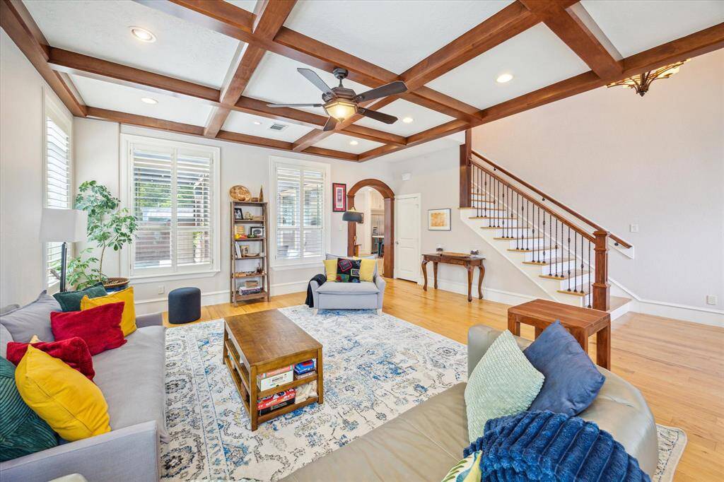 Flooded with natural light from all windows and offering tranquil views of the pool, this warm and inviting space is ideal for both everyday living and entertaining.