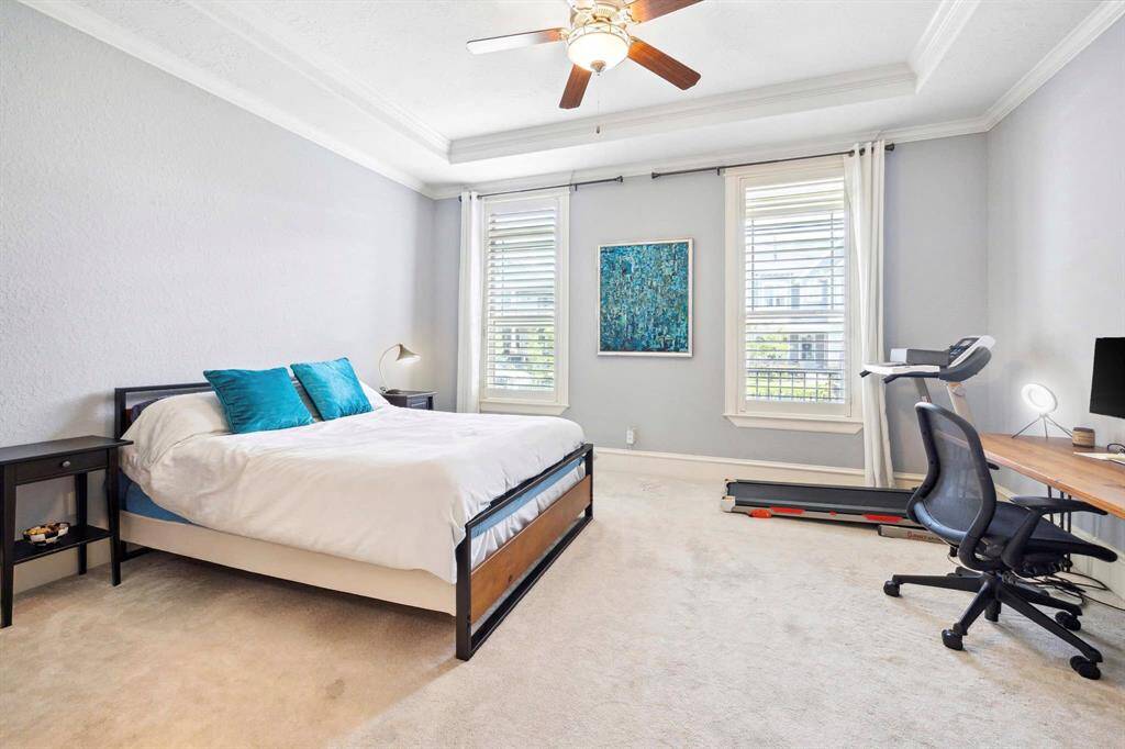 One of two primary bedrooms, this first-floor suite offers convenience and privacy—Ideal for visitors, extended stays, or those seeking main-level living.