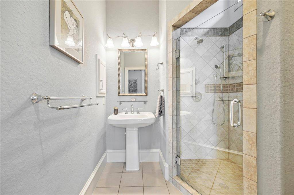 Walk-in shower with vanity space.