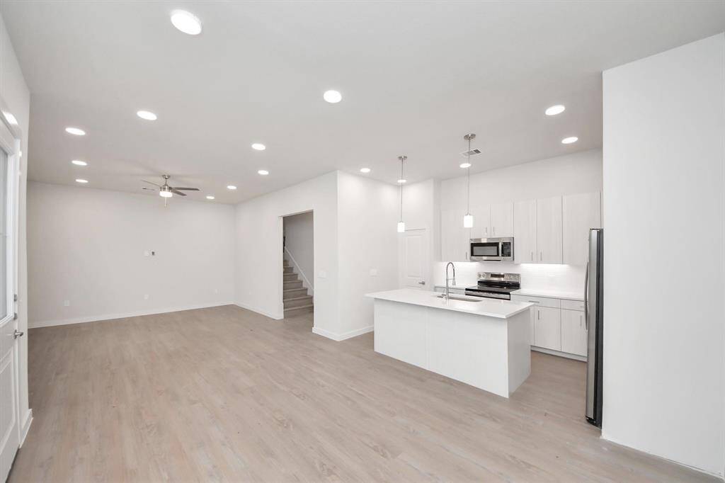 Stylish Island kitchens and open concept floor plans.Boasting modern finishes, quartz counters, tile backsplash,stainless appliances,refrigerator,washer & dryer,walk-in pantries,walk-in closets,wood-like floors throughout,9ft ceilings.