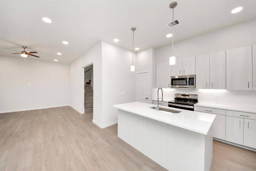 Stylish Island kitchens and open concept floor plans.Boasting modern finishes, quartz counters, tile backsplash,stainless appliances,refrigerator,washer & dryer,walk-in pantries,walk-in closets,wood-like floors throughout,9ft ceilings.