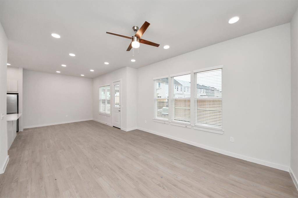 Open Living Concept…Boasting modern finishes, wood-like floors throughout and 9ft ceilings.