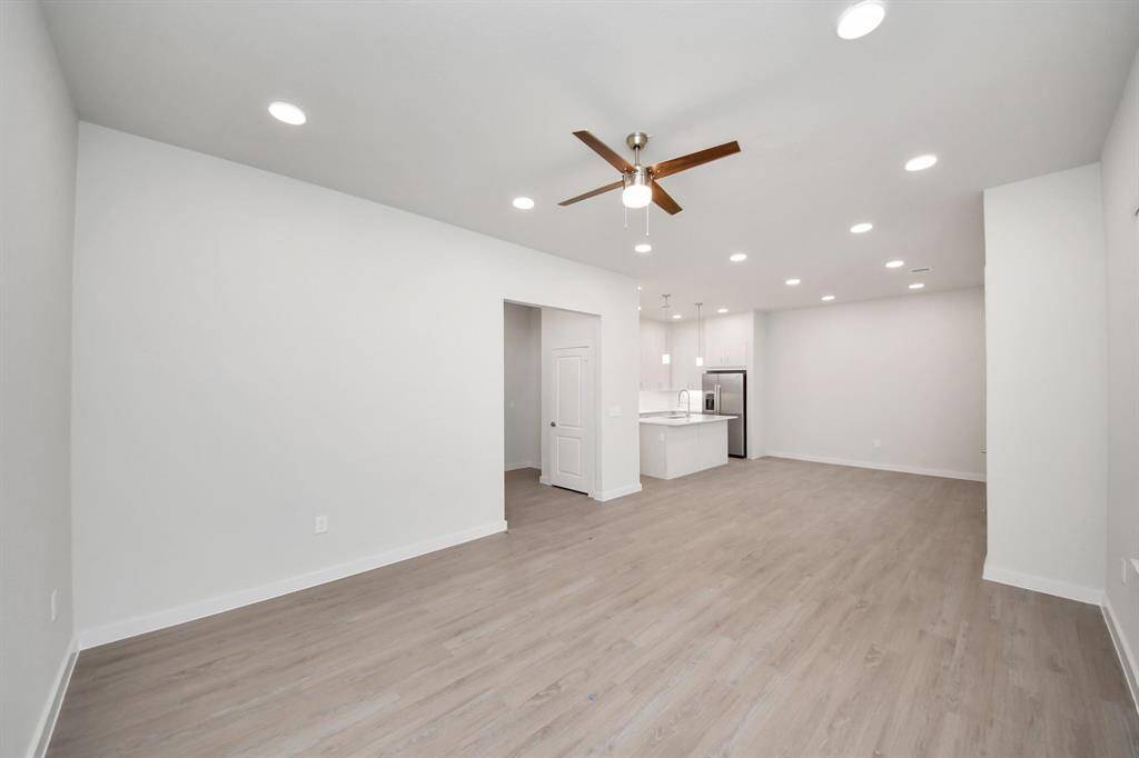 Open Living Concept…Boasting modern finishes, wood-like floors throughout and 9ft ceilings.