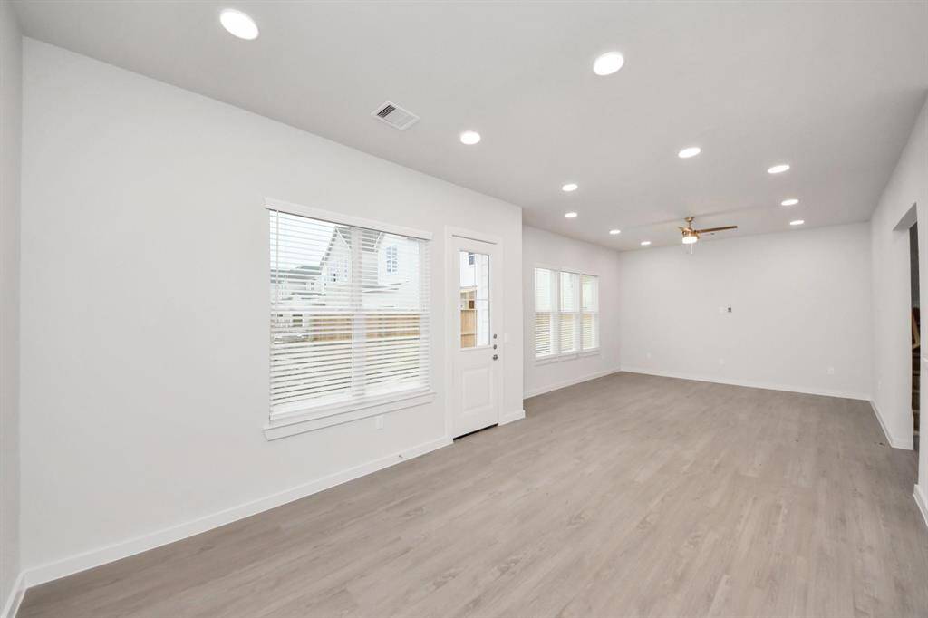 Open Living Concept…Boasting modern finishes, wood-like floors throughout and 9ft ceilings.