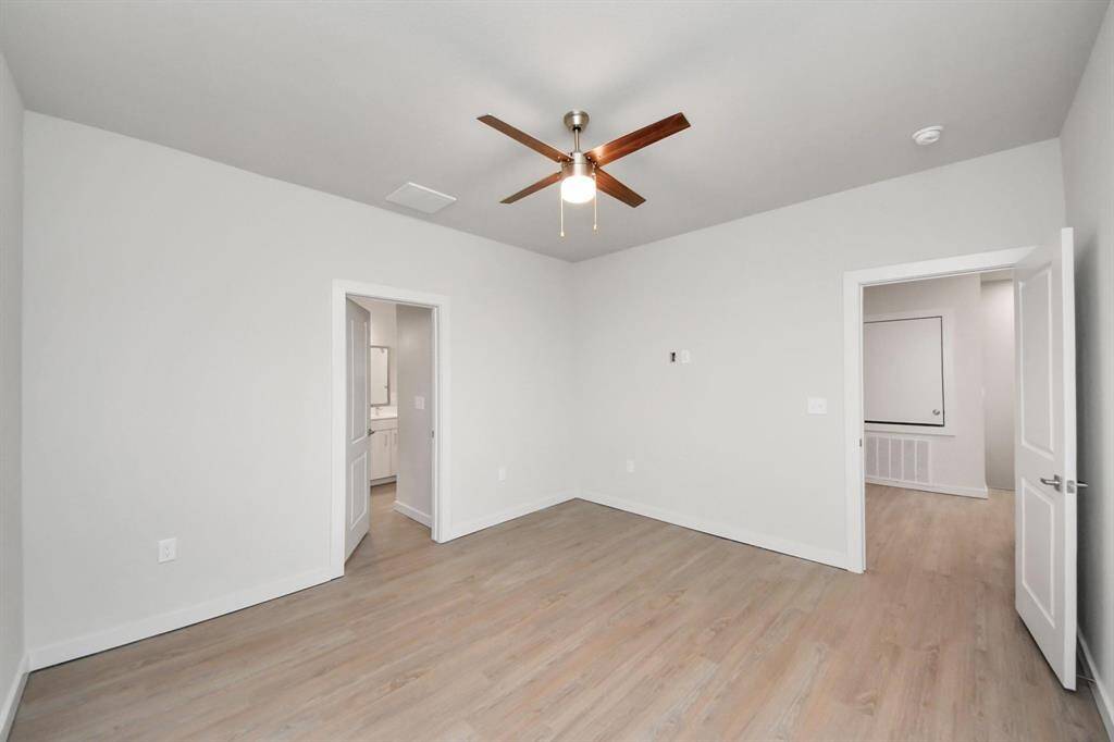 Spacious Owner’s retreat with wood-like floors, walk-in closet and spa-like bath w/dual sinks.