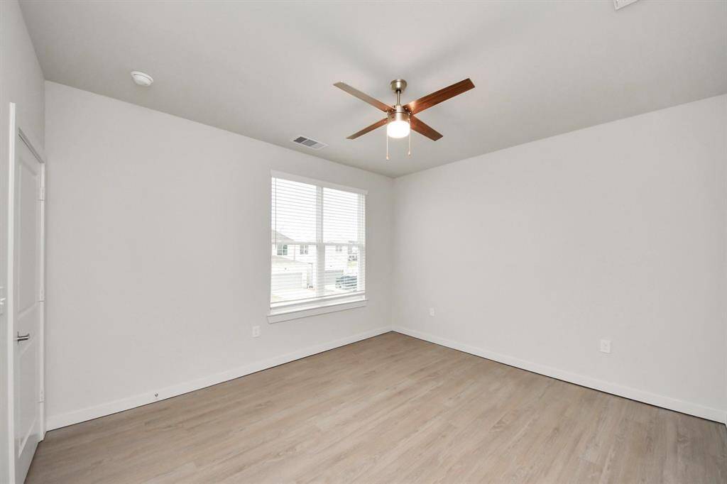 Spacious Owner’s retreat with wood-like floors, walk-in closet and spa-like bath w/dual sinks.