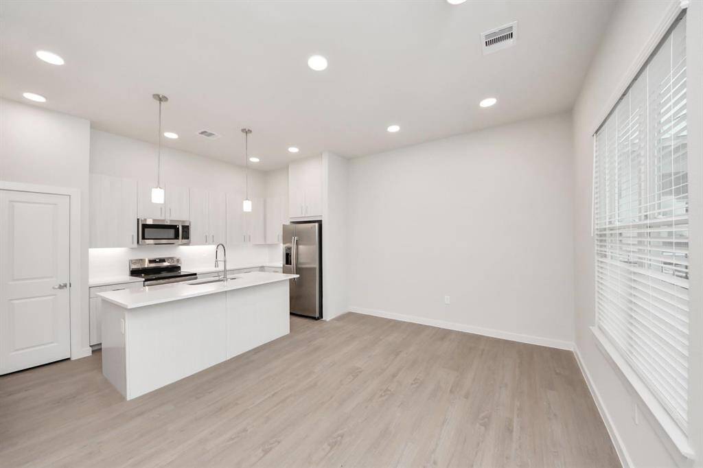 Stylish Island kitchens and open concept floor plans.Boasting modern finishes, quartz counters, tile backsplash,stainless appliances,refrigerator,washer & dryer,walk-in pantries,walk-in closets,wood-like floors throughout,9ft ceilings.