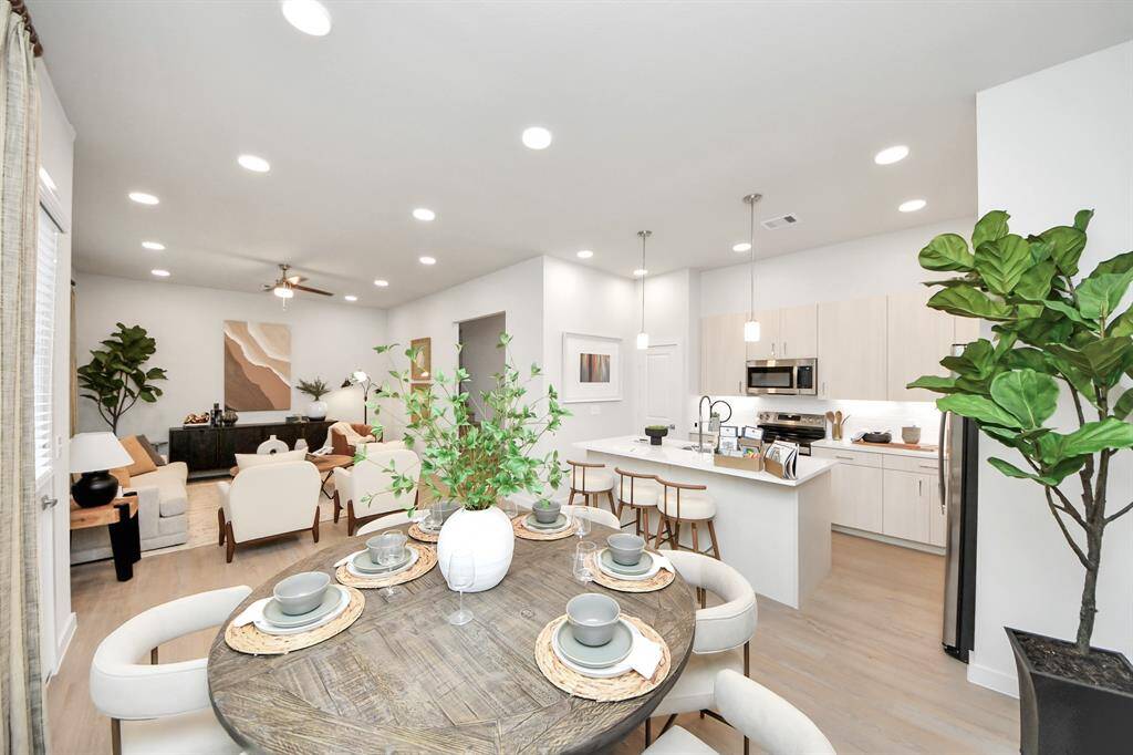 ! Boasting modern finishes, quartz counters, tile backsplash,stainless appliances,refrigerator,washer & dryer,walk-in pantries,walk-in closets,wood-like floors throughout,9ft ceilings