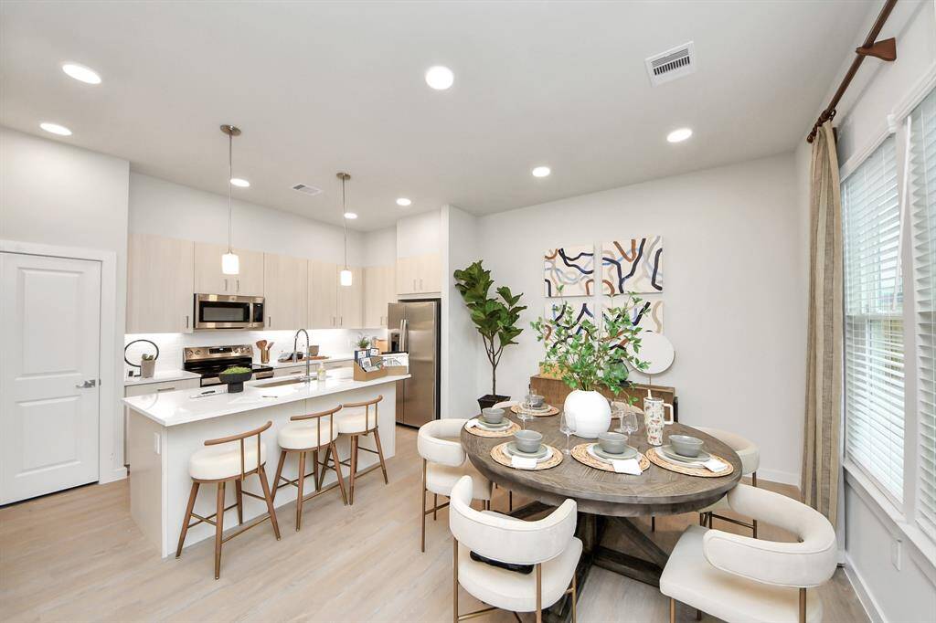 ! Boasting modern finishes, quartz counters, tile backsplash,stainless appliances,refrigerator,washer & dryer,walk-in pantries,walk-in closets,wood-like floors throughout,9ft ceilings