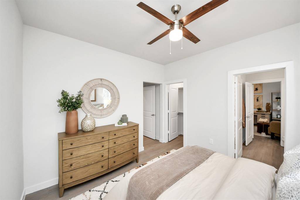 Secondary Bedrooms with wood-like floors & closet.