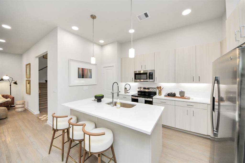 Stylish Island kitchens and open concept floor plans.! Boasting modern finishes, quartz counters, tile backsplash,stainless appliances,refrigerator,washer & dryer,walk-in pantries,walk-in closets,wood-like floors throughout,9ft ceilings.
