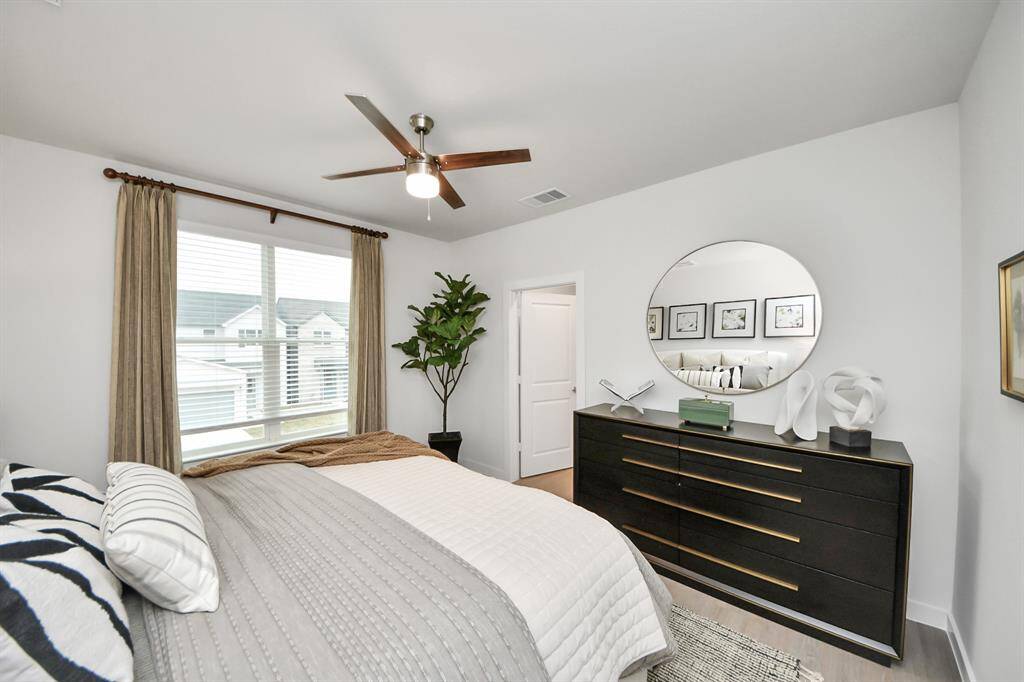 Spacious Owner’s retreat with wood-like floors, walk-in closet and spa-like bath w/dual sinks.