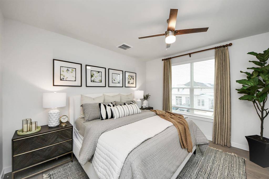 Spacious Owner’s retreat with wood-like floors, walk-in closet and spa-like bath w/dual sinks.