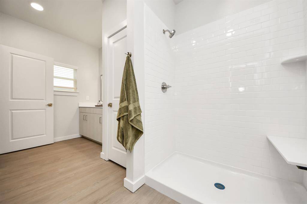 Spacious Owner’s retreat with wood-like floors, walk-in closet and spa-like bath w/dual sinks.