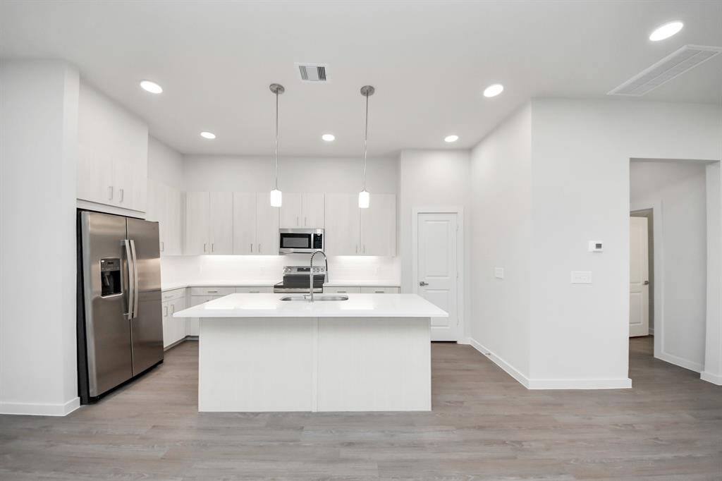 Stylish Island kitchens and open concept floor plans.! Boasting modern finishes, quartz counters, tile backsplash,stainless appliances,refrigerator,washer & dryer,walk-in pantries,walk-in closets,wood-like floors throughout,9ft ceilings.