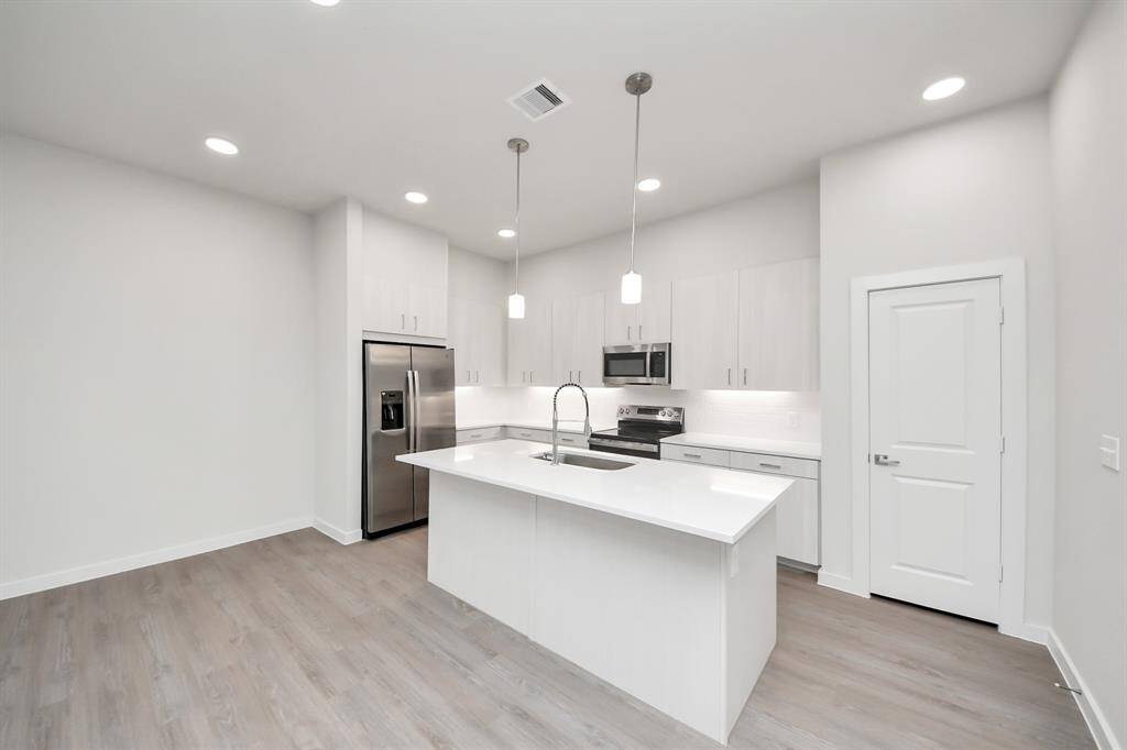 Stylish Island kitchens and open concept floor plans.! Boasting modern finishes, quartz counters, tile backsplash,stainless appliances,refrigerator,washer & dryer,walk-in pantries,walk-in closets,wood-like floors throughout,9ft ceilings.