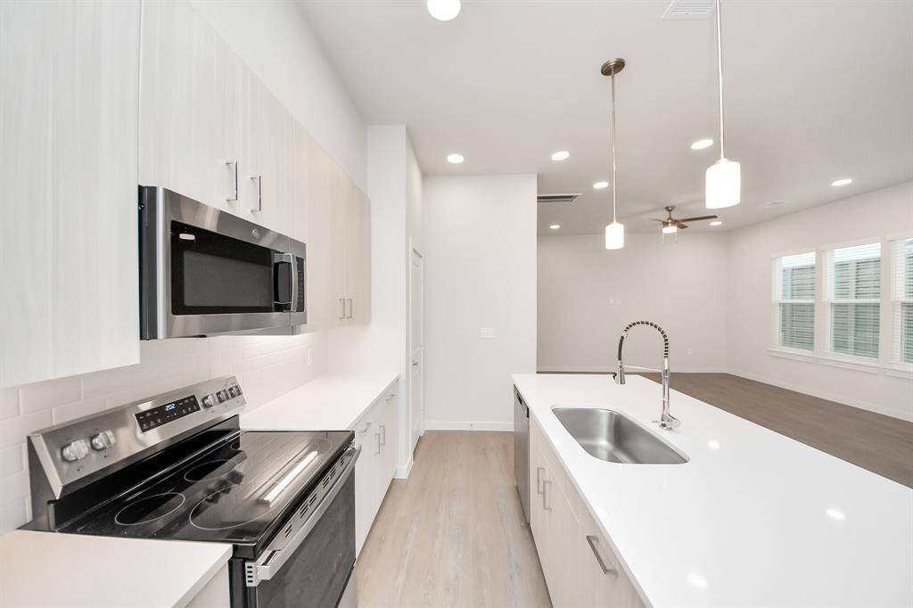 Stylish Island kitchens and open concept floor plans.! Boasting modern finishes, quartz counters, tile backsplash,stainless appliances,refrigerator,washer & dryer,walk-in pantries,walk-in closets,wood-like floors throughout,9ft ceilings.