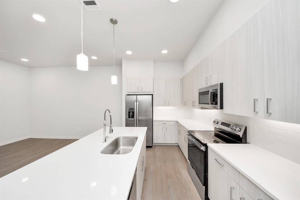 Stylish Island kitchens and open concept floor plans.! Boasting modern finishes, quartz counters, tile backsplash,stainless appliances,refrigerator,washer & dryer,walk-in pantries,walk-in closets,wood-like floors throughout,9ft ceilings.