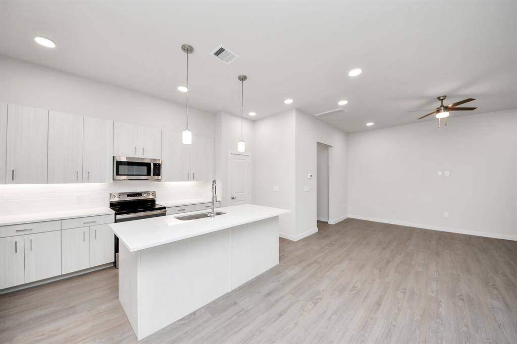 Stylish Island kitchens and open concept floor plans.! Boasting modern finishes, quartz counters, tile backsplash,stainless appliances,refrigerator,washer & dryer,walk-in pantries,walk-in closets,wood-like floors throughout,9ft ceilings.