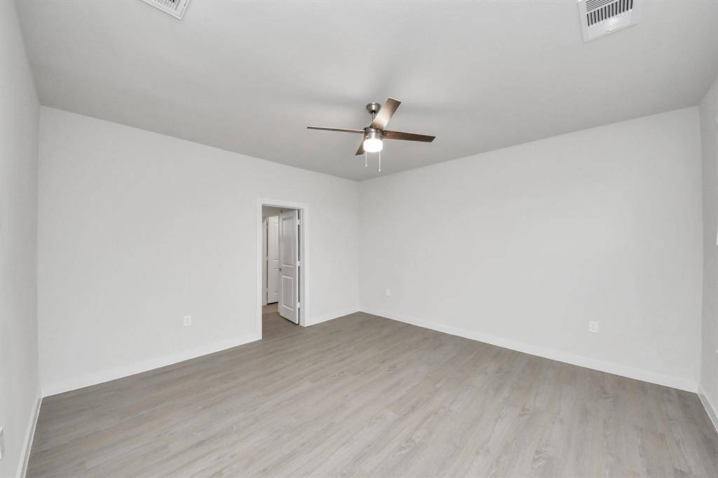 Spacious Owner’s retreat with wood-like floors, walk-in closet and spa-like bath w/dual sinks.