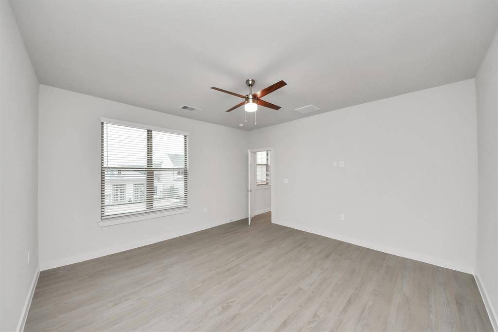 Spacious Owner’s retreat with wood-like floors, walk-in closet and spa-like bath w/dual sinks.