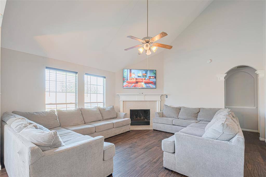 Gather together in the large family room with ample natural light and vaulted ceiling.