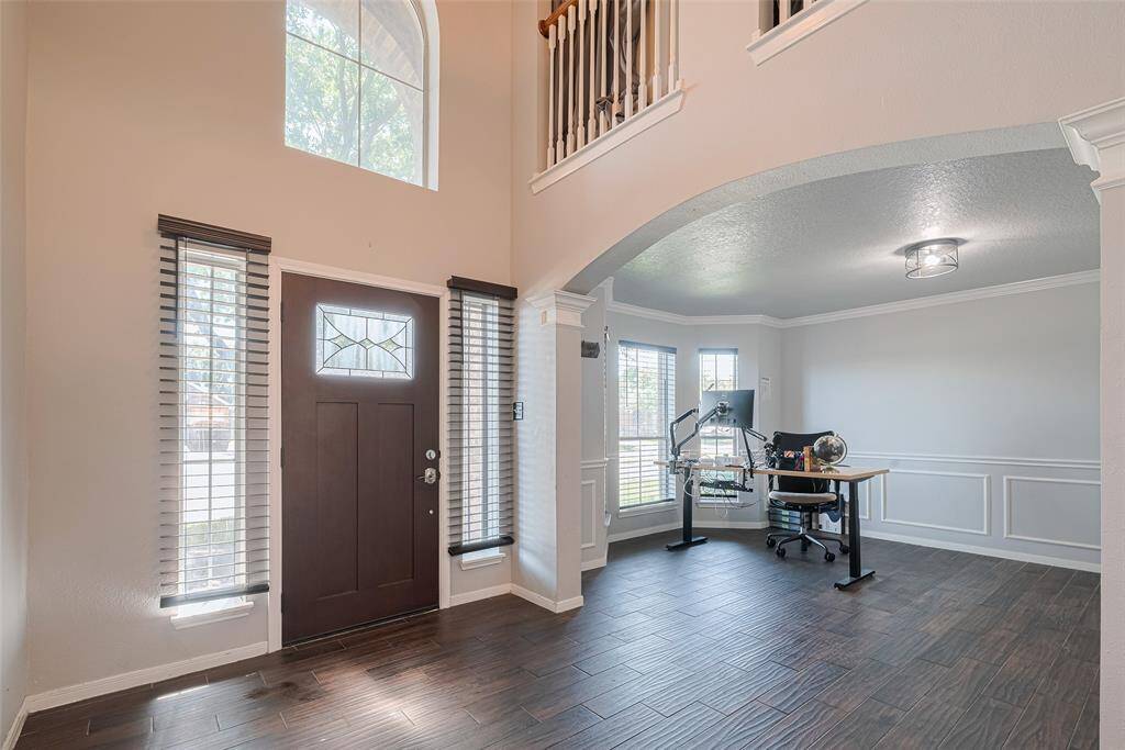 The soaring entry is perfect for welcoming guests.