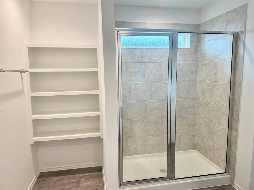 Huge shower and extra linen storage.