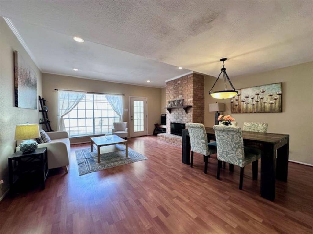 Living and dining room with patio access.