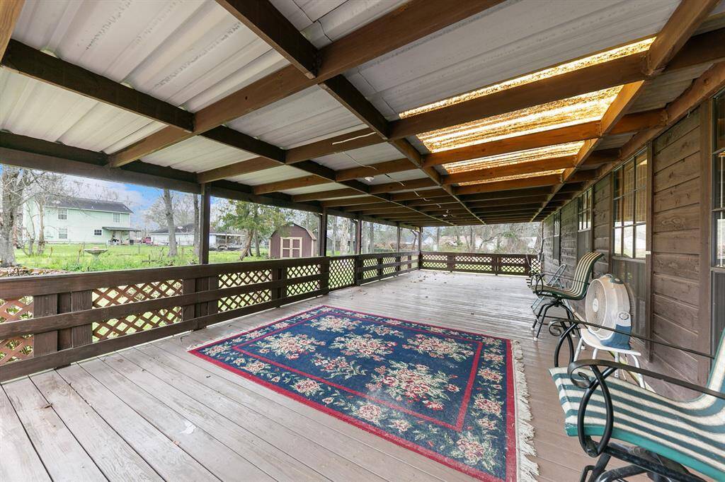 The covered patio provides a perfect outdoor space to relax or entertain, offering protection from the elements while enjoying the backyard.