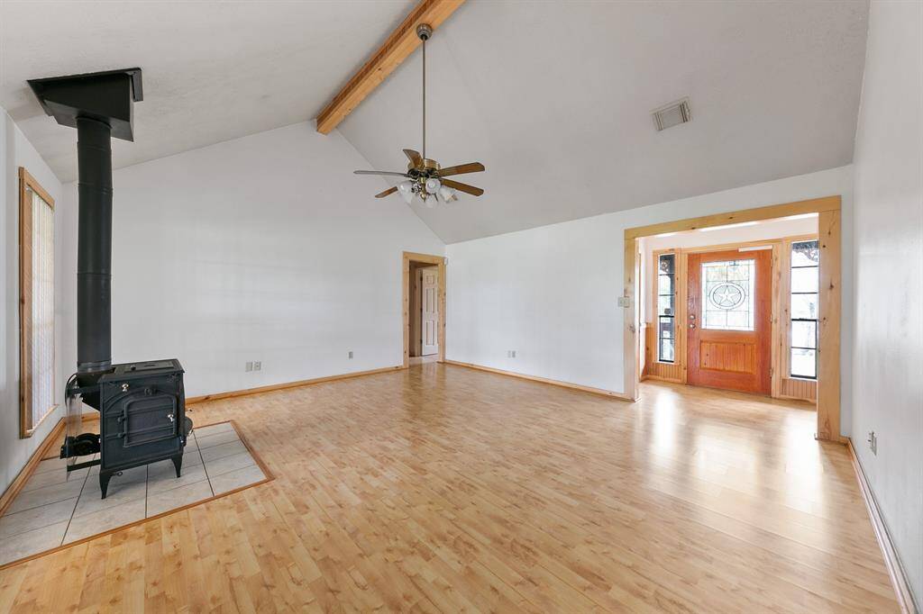 The home features beautiful wood floors throughout the main living areas, adding warmth and timeless appeal to the space.