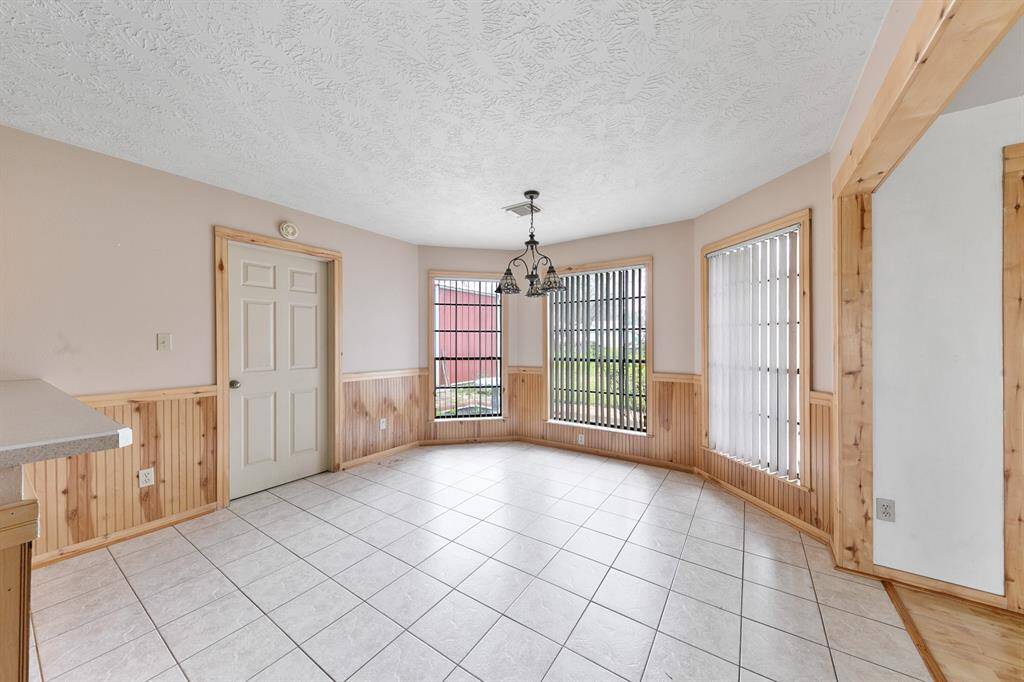 The kitchen is enhanced by a charming bay window, allowing natural light to flood the space and providing a cozy nook for enjoying meals or a quiet moment.