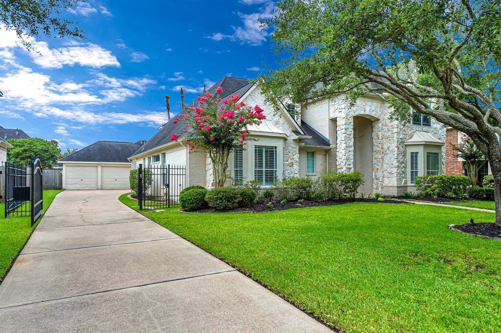 A long drive way with Gate