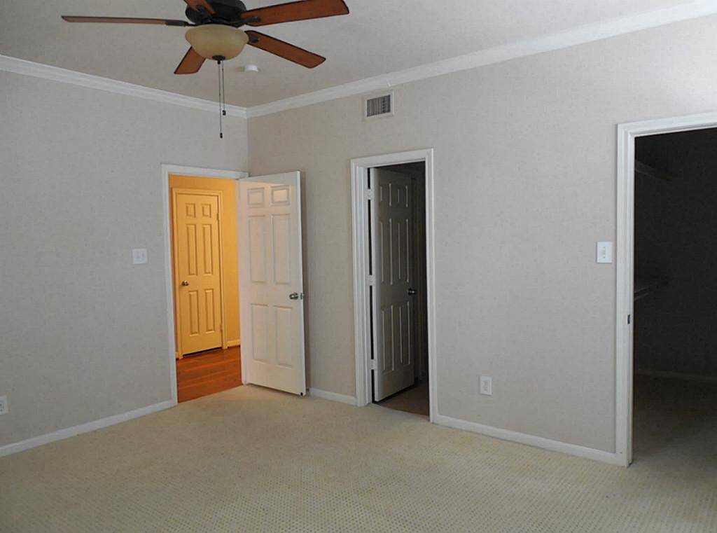 Large master bedroom with spacious closet and private access to the bathroom