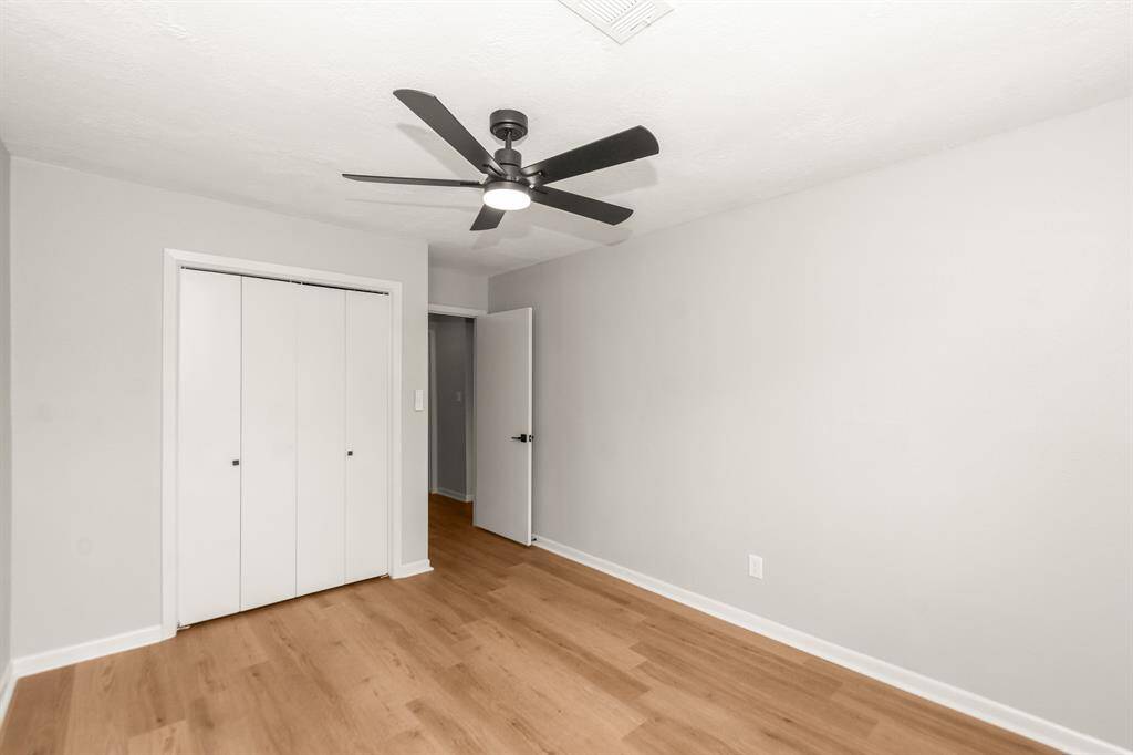 Secondary bedroom #2 located closest to the living area, also features LVP flooring, fresh paint and a new fan.