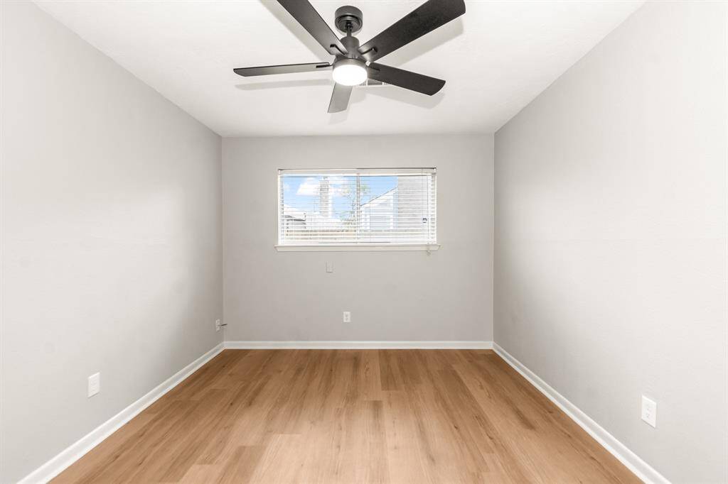 This bedroom also overlooks the backyard.