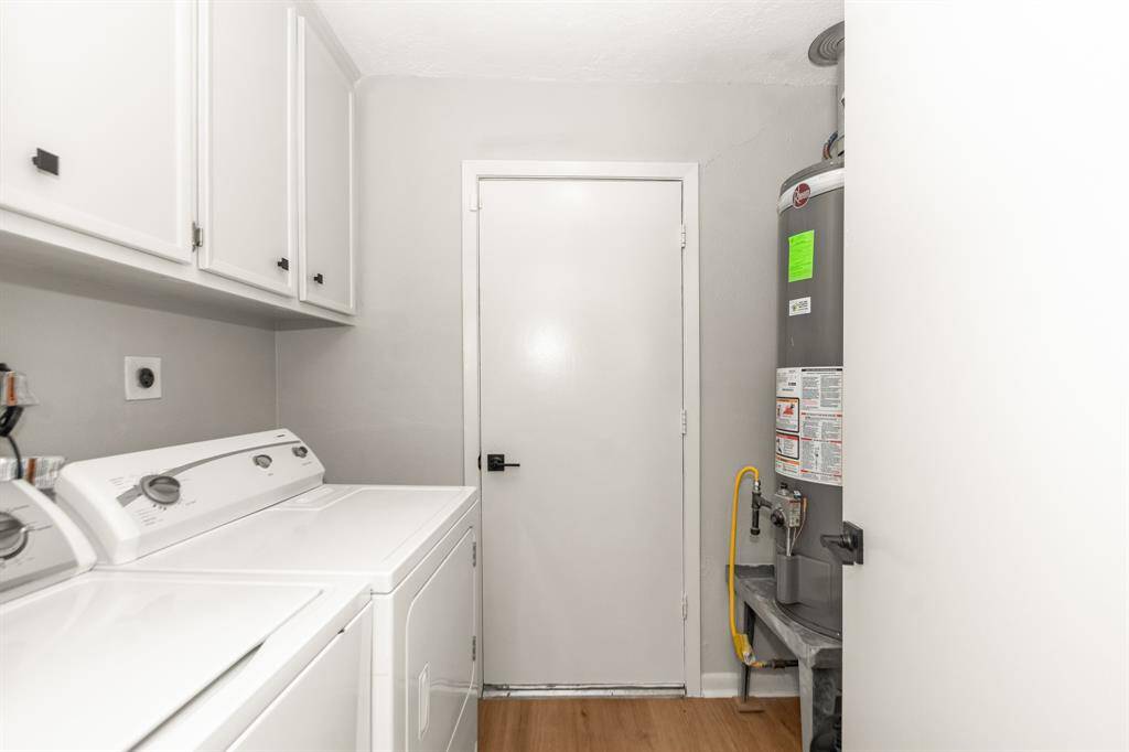 Laundry room is located by the kitchen with access to the garage.