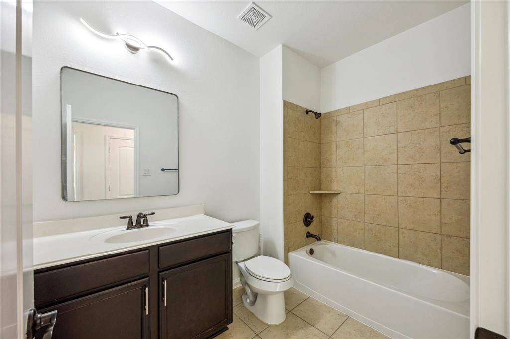 Guest bathroom with tub/shower combo.