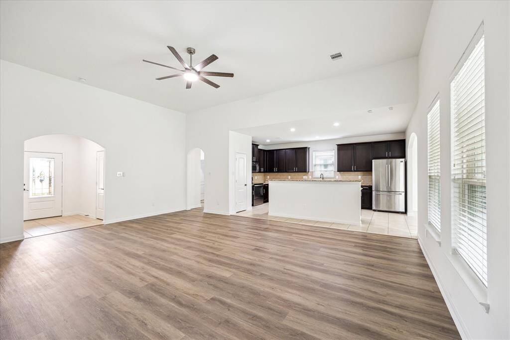View of family room looking toward the foyer and kitchen.
