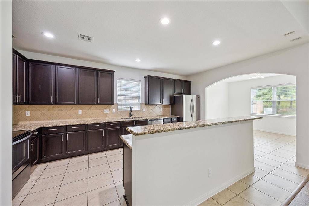 Kitchen with dining room on the right.
