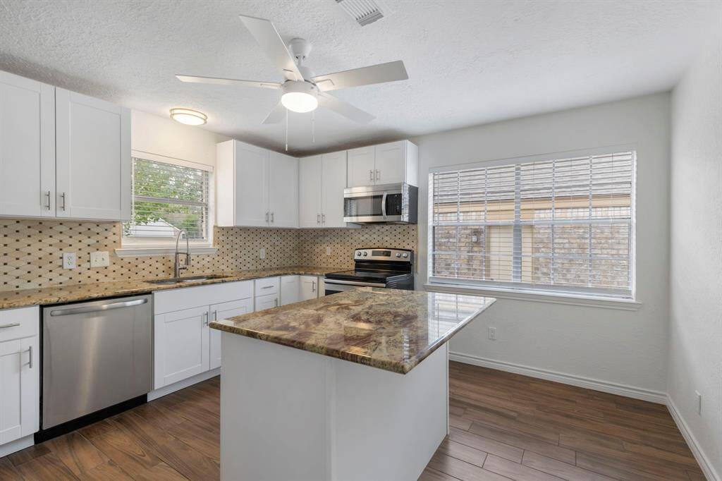Renovated kitchen with breakfast island.