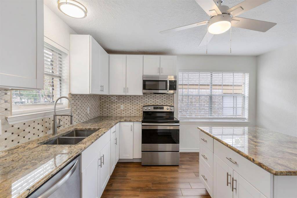 Beautiful selections with granite countertops and neutral backsplash.