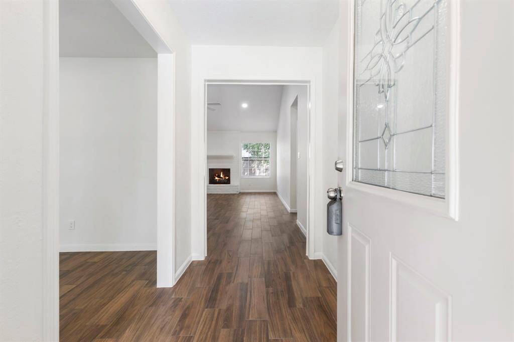 Formal entry way leading that opens to the formal dining room and living room.