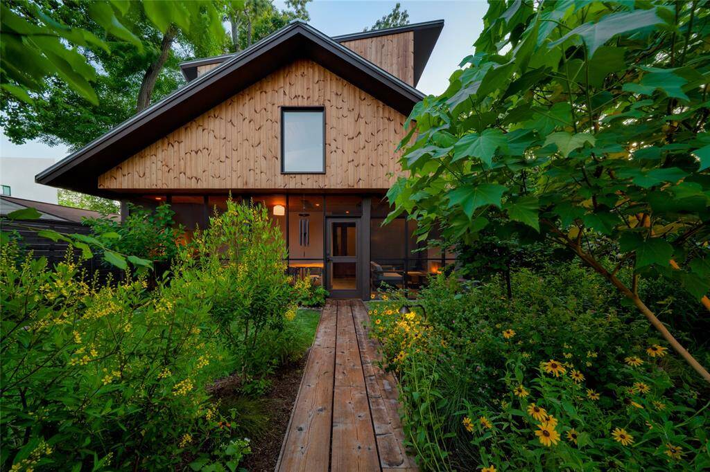Tranquil garden oasis attracting butterflies, birds, and honeybees.