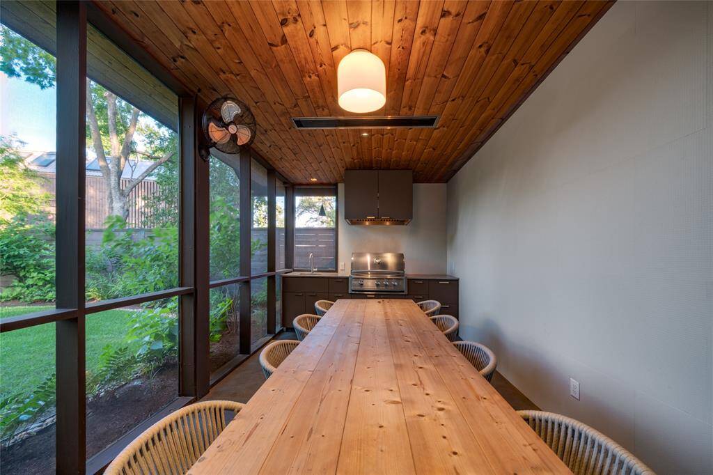 Spacious outdoor kitchen with seating for eight, perfect for entertaining.