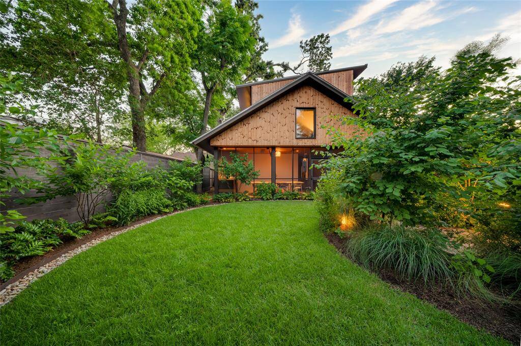 Expansive backyard perfect for children's play and activities.