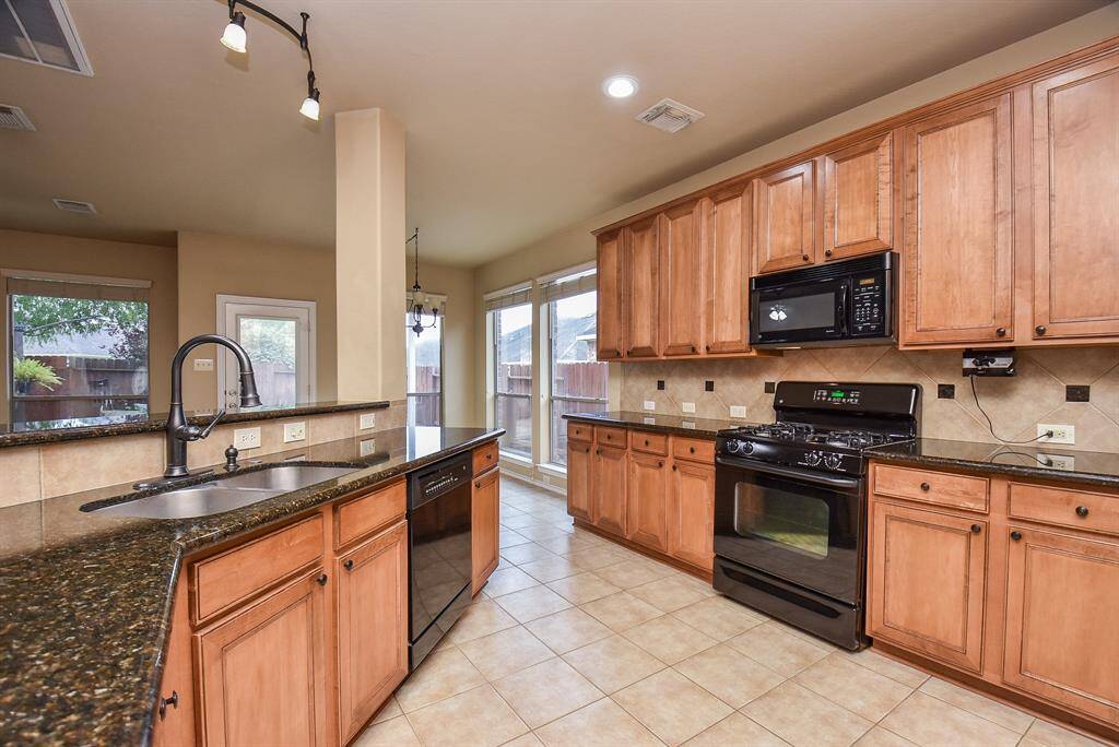 Kitchen with Granite counter gas range and ample cabinet space