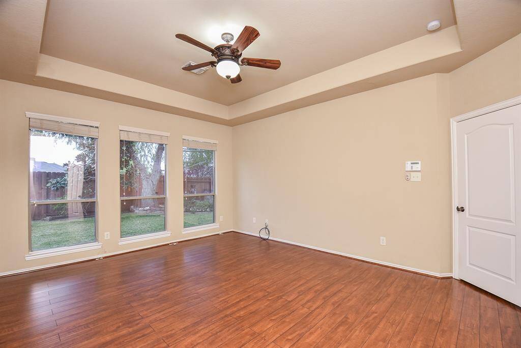 Master Bedroom with beautiful engineered wood floors and lots of natural light